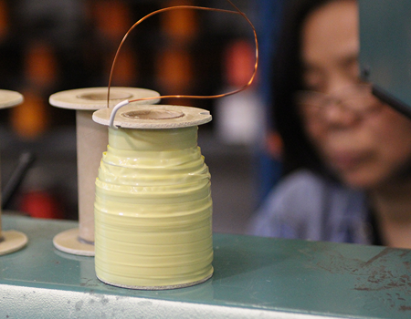 Bobbin wound with spacing to accommodate electrics.